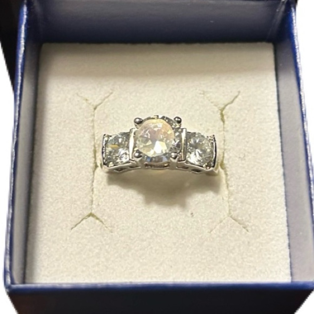 Three stone simulated engagement ring